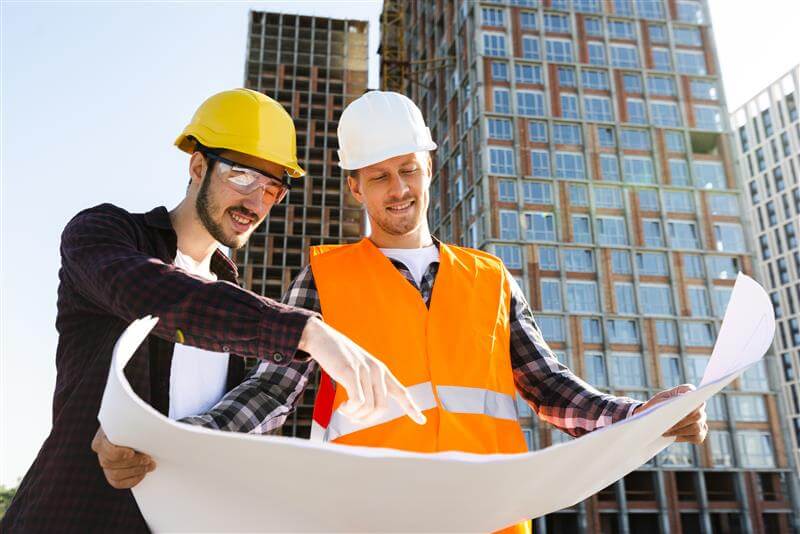 medium-shot-low-angle-view-engineer-architect-supervising-construction
